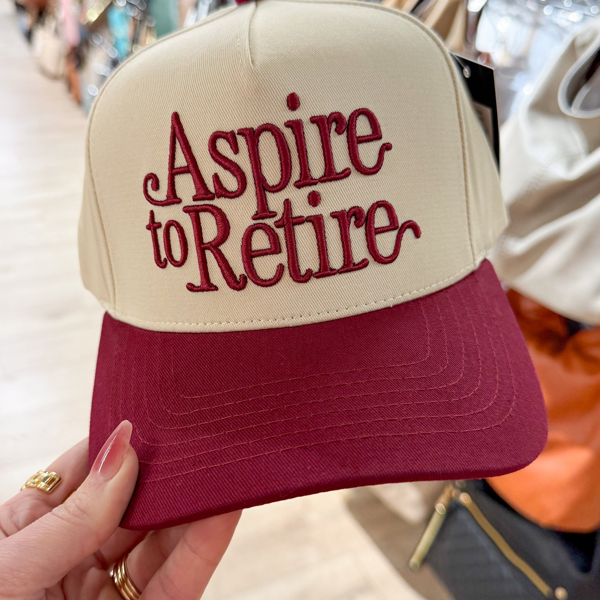 Aspire To Retire Embroidered Trucker Hat