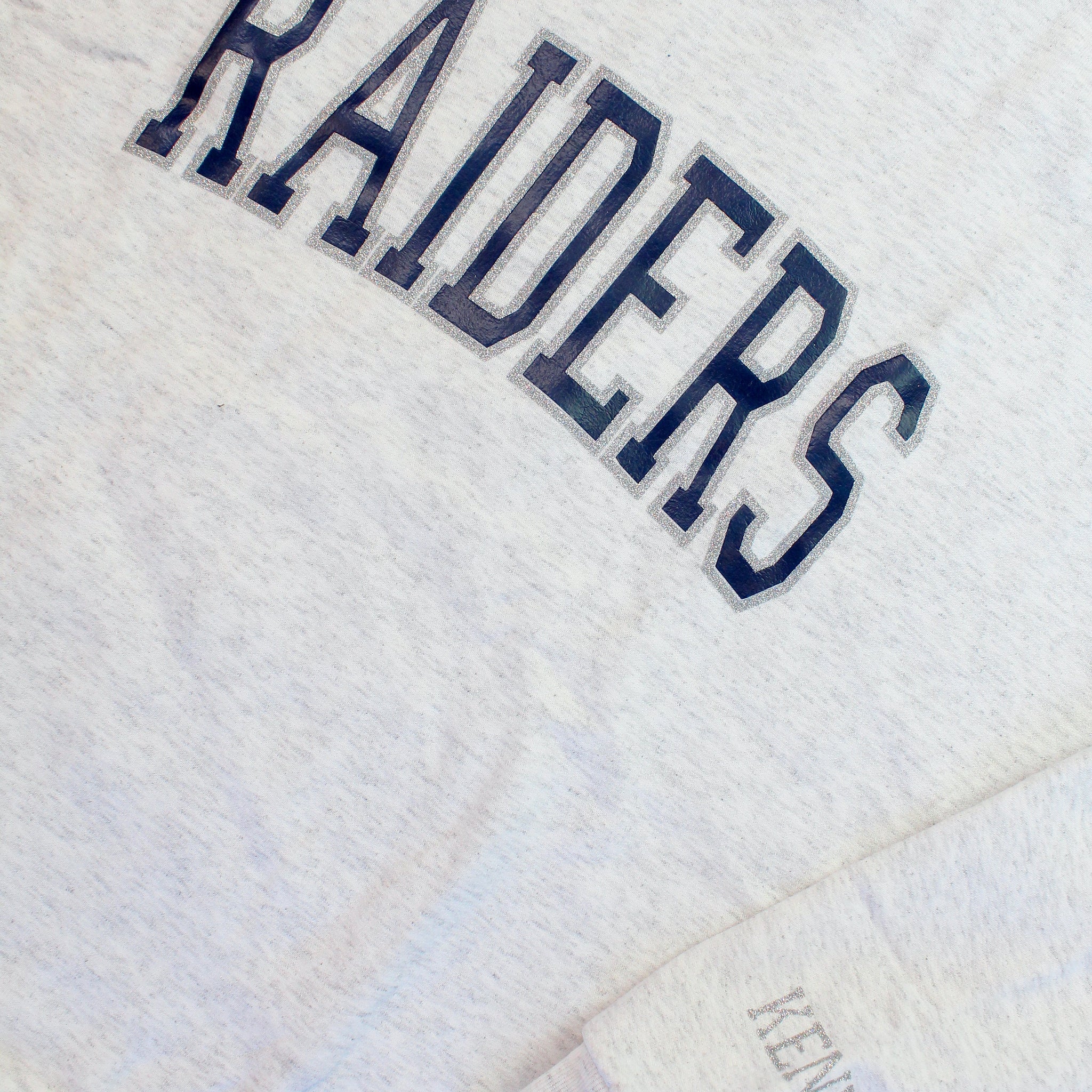 Raiders Navy And Silver Glitter Varsity Sweatshirt
